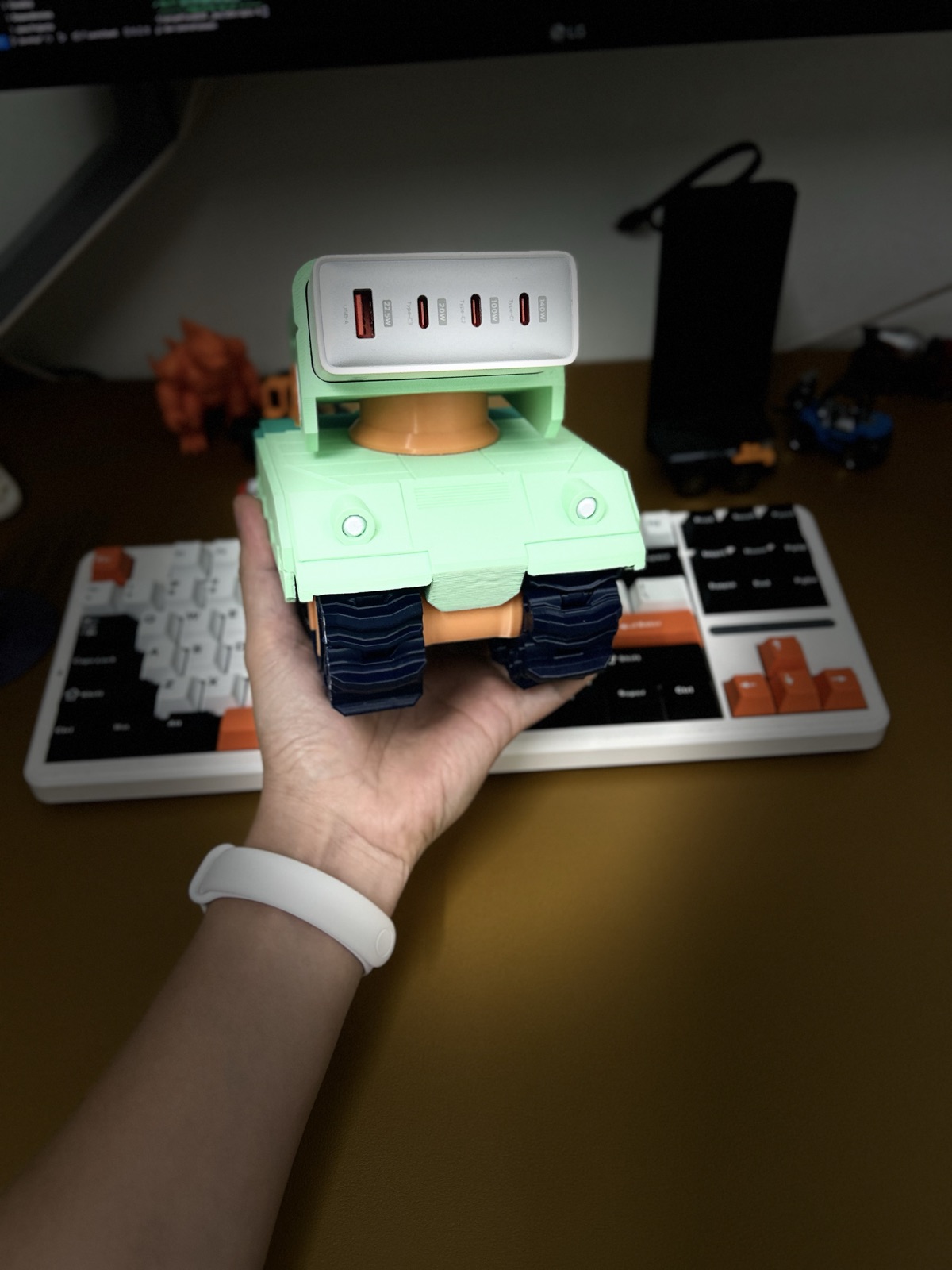Finished dock held in hand, charger ports facing the camera